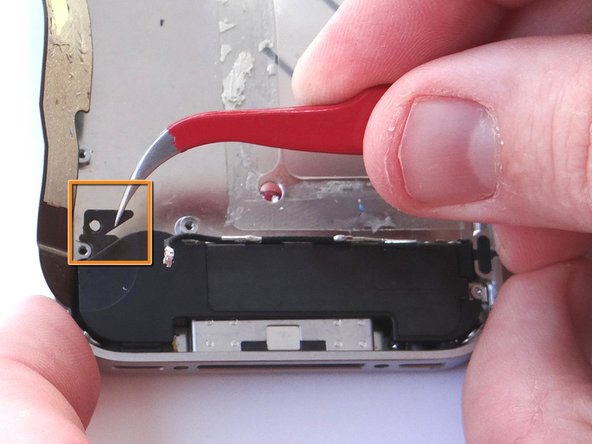 Remove the small plastic Triangular Bracket that was installed under the left-most screw.  Place in SLOT 12 with the two screws.