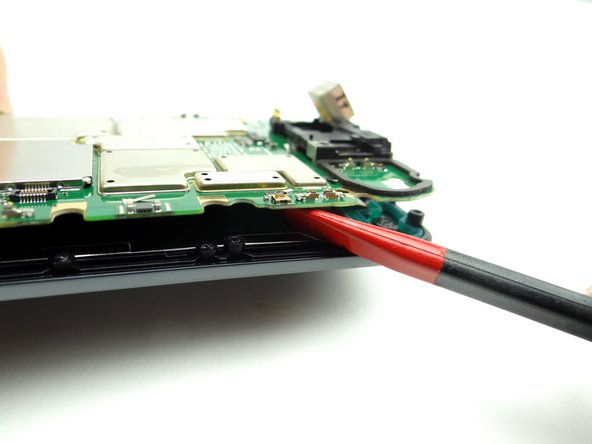 Picture 2: Gently twist the spudger clockwise.