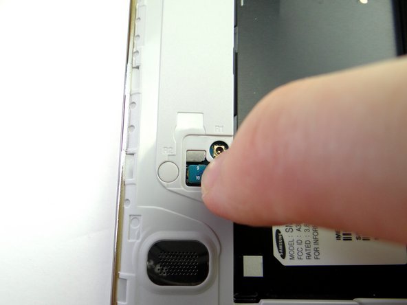 On the underside, connect the home button to the logic board.