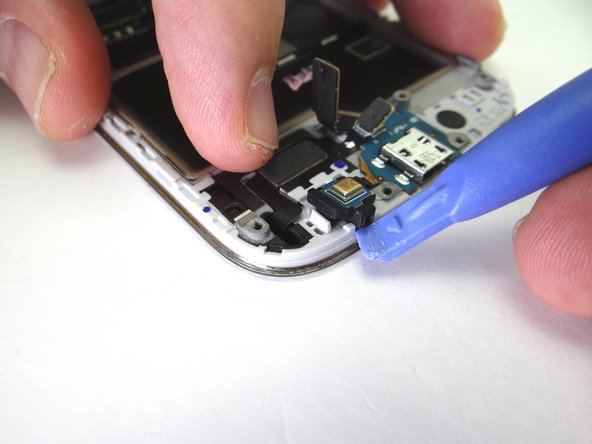 Don't try to remove the microphone - it's part of the charging port assembly.