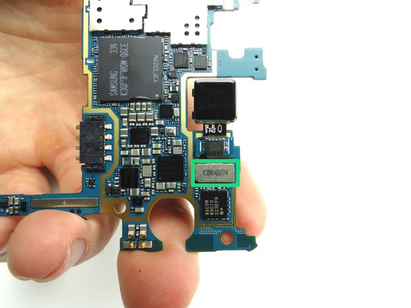 From COMPARTMENT B, replace rear-facing camera on underside of logic board