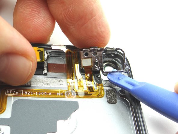 Use the blue pry tool and your finger to pry up the rear camera socket.