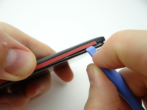 Remove the pry tool when you reach the volume rocker.