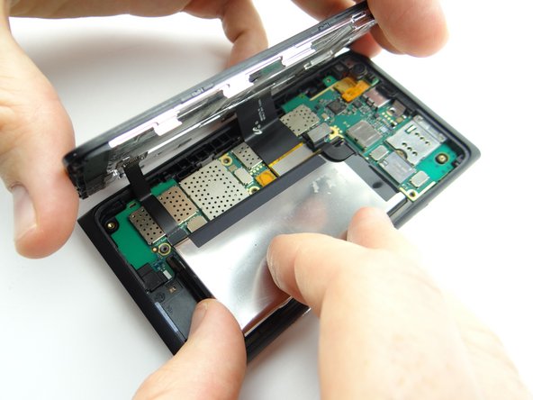 Seat the battery and connect it to the logic board.