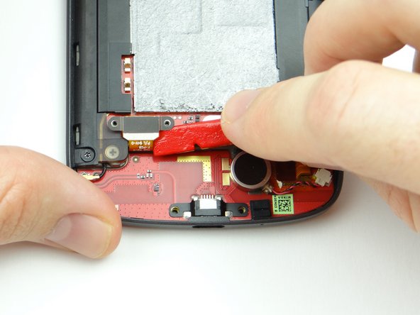 Use flat end of spudger to disconnect the battery.