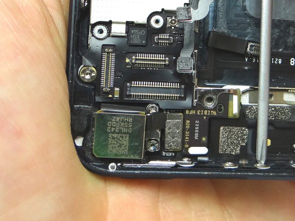 Stabilize the phone while you're removing the screws by holding it as in Picture 2.