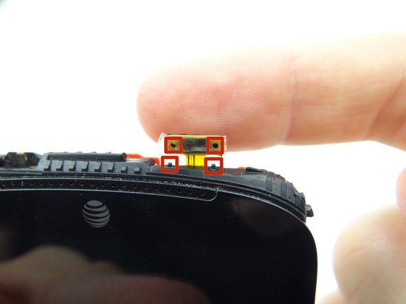 Line up the openings on the power button cable with the mounting tabs on the front panel (red squares).  Push power button cable into place.