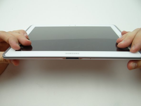 Examine all edges to ensure all clips are seated and the display is flush with the rear case.