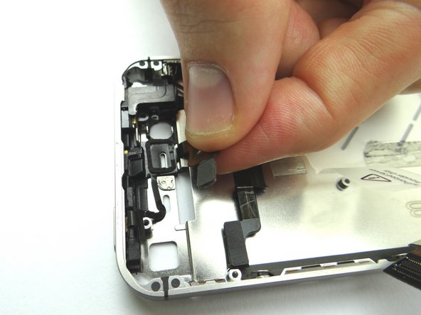 Picture 2: Use your fingers to secure down the ribbon cable and power button into their position.