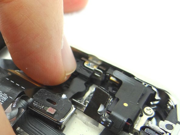 Ensure it is snapped back into place by firmly pressing down with your index finger.