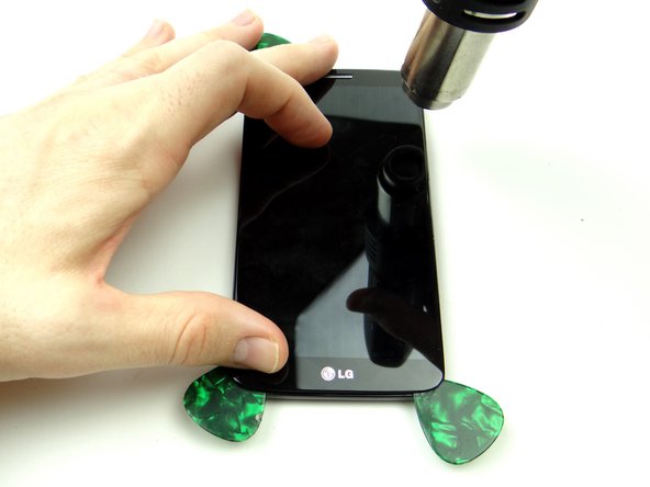 Pictures 1 &amp; 2: Heat the right side of the display.  Insert a guitar pick in the upper-right corner and roll it down the right side.