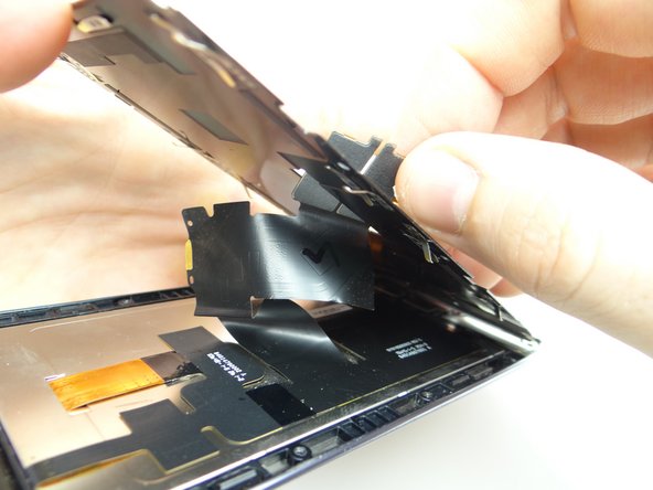 Feed display assembly cable through while seating metal plate.