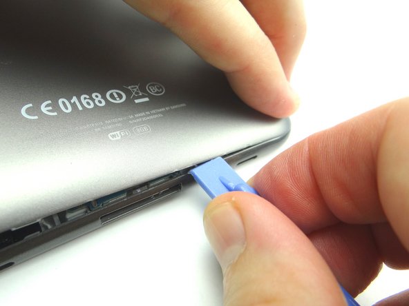 Picture 2: Sweep along the bottom with the blue pry tool while peeling up with your fingers.