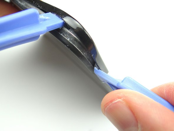 Pictures 1 &amp; 2: Use a blue pry tool (face up) to pry up the bottom of the trim near the volume rocker.  Gently pry up to release the tab (red square).