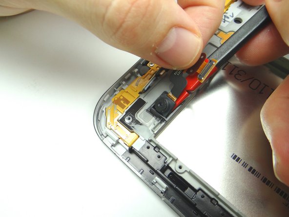 Use spudger to peel up rear camera.