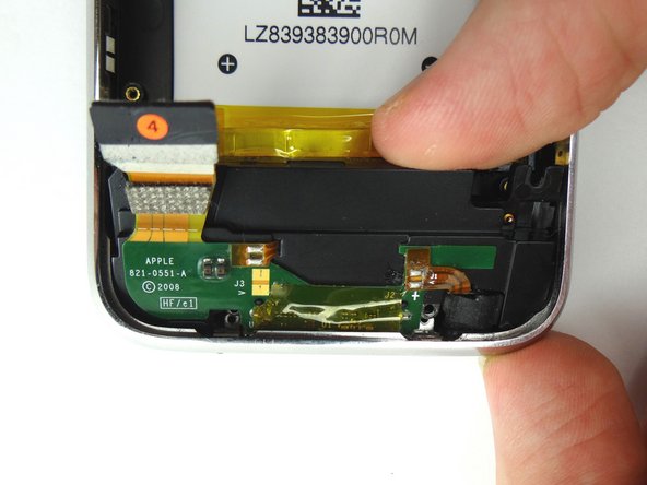 Place your index finger on the charging port as shown.  Pivot up and pull away to remove it.  Place in ZONE IV.
