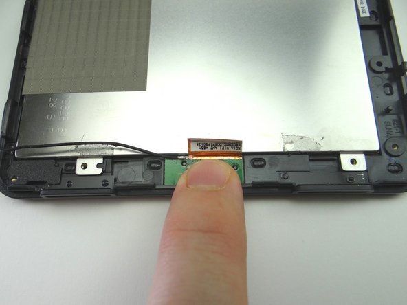 Pictures 2 &amp; 3: From COMPARTMENT C, seat wifi antenna on front glass frame, lining up the holes in the antenna board with the tiny protrusions on the frame.  Adhere antenna tape to back of LCD.