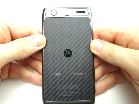 Pictures 1 &amp; 2: Press firmly along all edges of the phone to secure the clips.