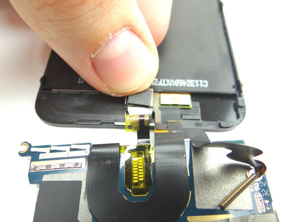 Picture 2: Push the front-facing camera into its slot on the front panel.