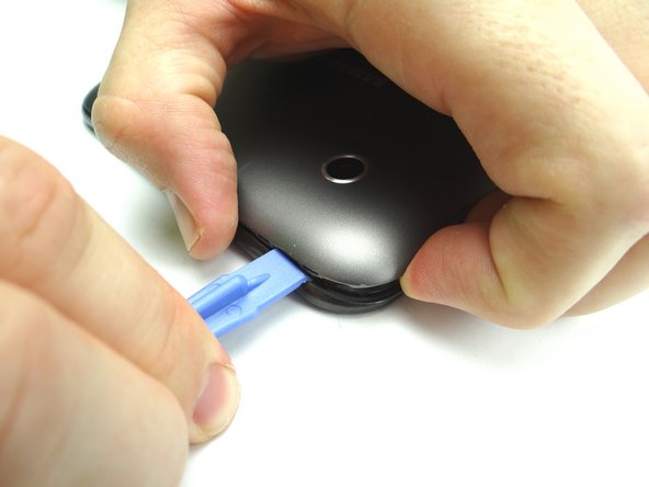 Picture 2: Insert near the corner as shown and gently twist to pry up.