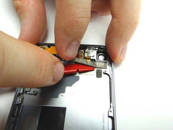 Starting on the left, peel up the tape roll covering the buttons cable.  Place in COMPARTMENT C.