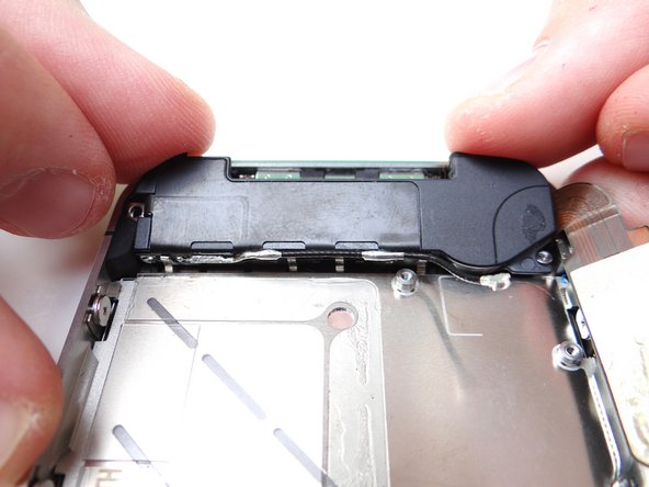 Grab speaker assembly from COMPARTMENT D and place it inside mid-frame.  Push the front of the assembly (with the clips) down first, then push the entire assembly into place.