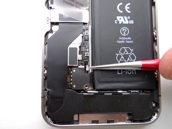 Picture 3: Use Fine Point Tweezers to remove the L-Shaped Antenna Shield before releasing the battery connector. Place the Antenna Shield with the screw in SLOT 3.