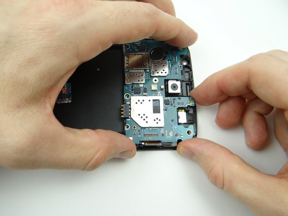 Make sure the display cable and volume cable aren't trapped underneath.