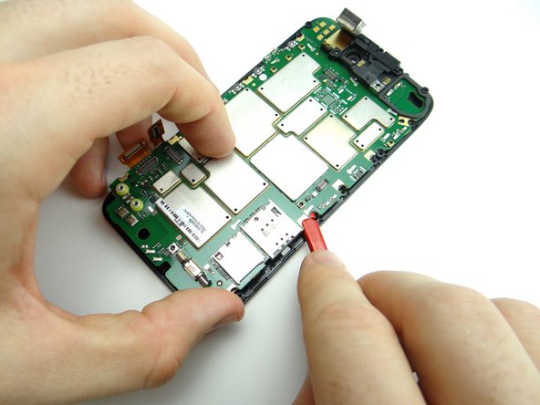 Reinsert the spudger above the SIM card tray.