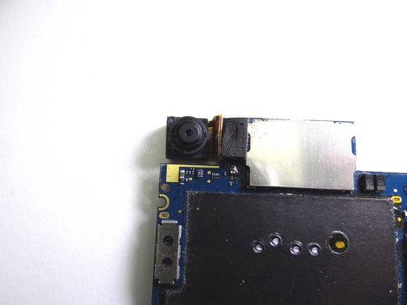 Remove rear camera from underside of logic board.  Place in COMPARTMENT B.