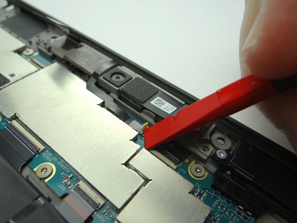 Picture 3: Use the corner of the black spudger to open the small white microphone ZIF connector.