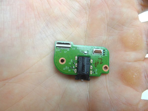 From COMPARTMENT D, replace headphone jack board.