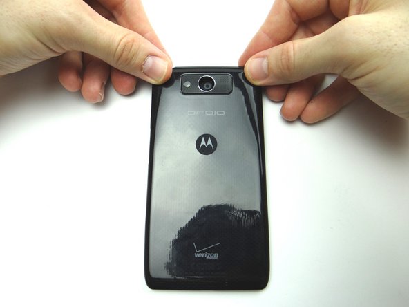 Pictures 2 &amp; 3: Peel up the battery cover as much as you can without creating stretch marks.