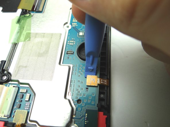 Picture 1: Use blue pry tool to disconnect power / volume buttons cable.