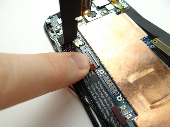 Gently pull LCD cable free with your finger.