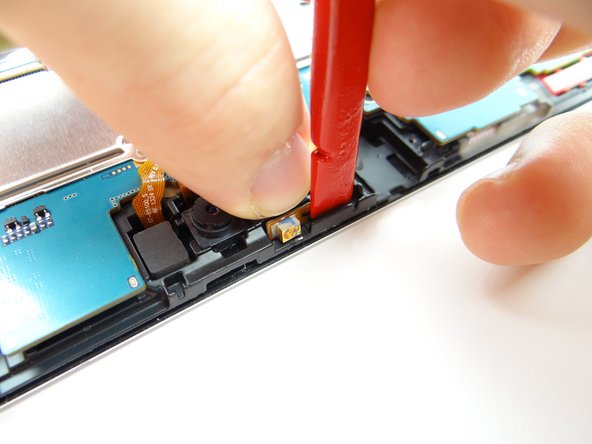 Picture 1: Replace infrared sensor from COMPARTMENT C.  Use flat end of spudger to push infrared cable against the mid-frame wall.