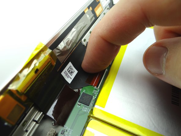 Guide the triangular display cable into the ZIF connector using your finger.