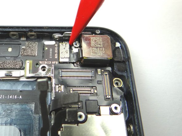 Picture 1: Use the tip of the Black Spudger to dislodge the camera flash from its insert.