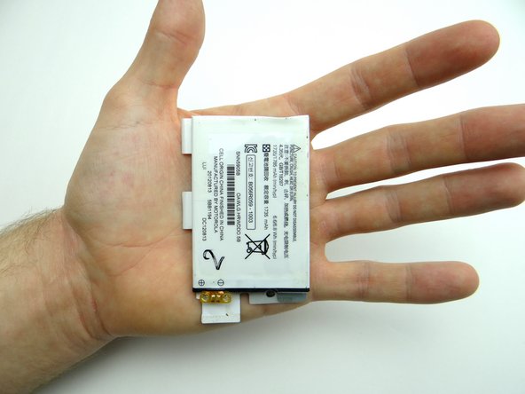 Place the battery on top of the battery cover in ZONE I.