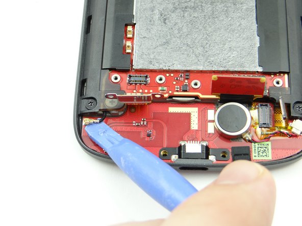 Pictures 2 &amp; 3: Disconnect antenna then gently bend straight up (so it's out of the way when you remove the charging port board).