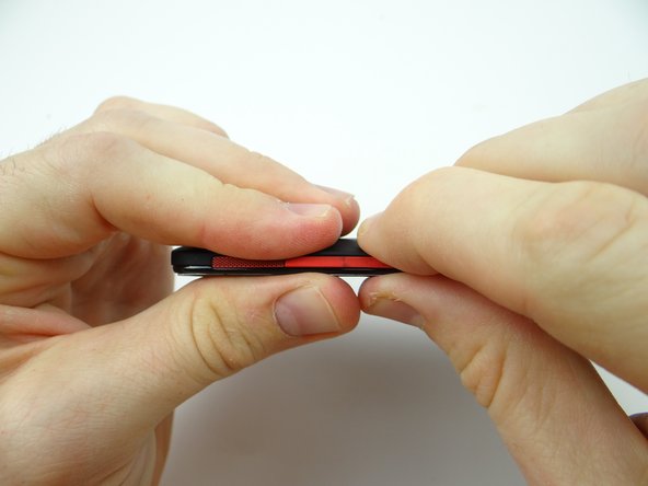 Work your way around the perimeter making sure all battery cover clips are snapped in place.