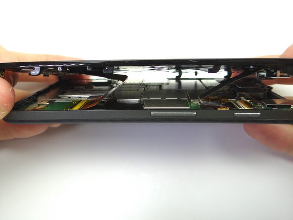 Lift the front panel an inch above the rear panel.