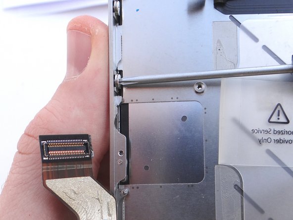 Pictures 1 and 2: Loosen the three large-head Phillips screws along the left side of the iPhone about one half turn, taking care not to remove these screws.