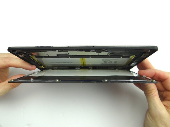 Picture 2: Open the screen like a book until all clips are released.