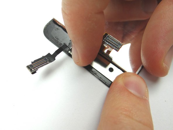 Picture 3: Place front-facing camera bracket from COMPARTMENT A on the display assembly.