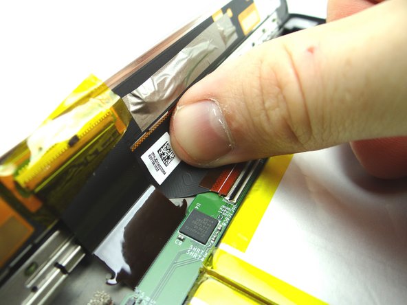 Gently guide the display cable out of the ZIF connector.