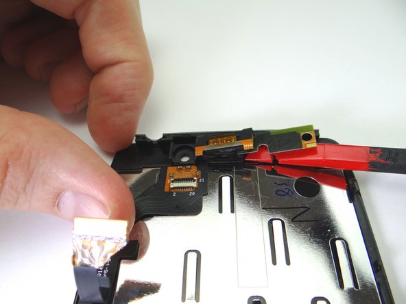 Strong adhesive holds the earpiece speaker and component cable assembly in place: