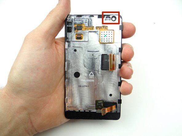 It may take some fiddling to get the front-facing camera &amp; proximity sensor assembly properly seated in the display sockets (red square) as you close the device over the next few steps.