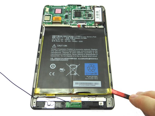 Picture 1: Wedge the spudger under the lower-right corner of the battery.