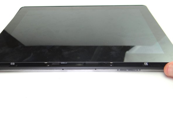 Pictures 1 &amp; 2: Press the top of the display assembly firmly into the rear case to secure the clips along the top edge.